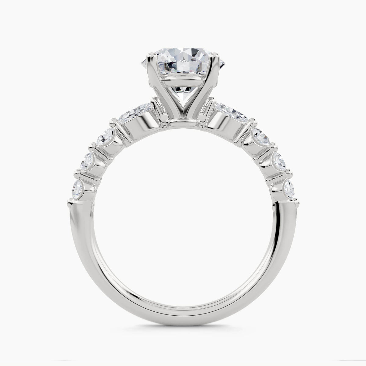 Solitaire Ring with Pear & Round Side Stones, front view