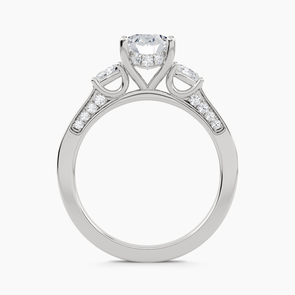 Three-Stone Ring with Pear Side Stones and Pavé Shoulders, front view