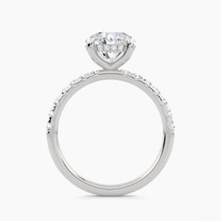 Solitaire engagement ring with hidden halo and pave set shank, front view