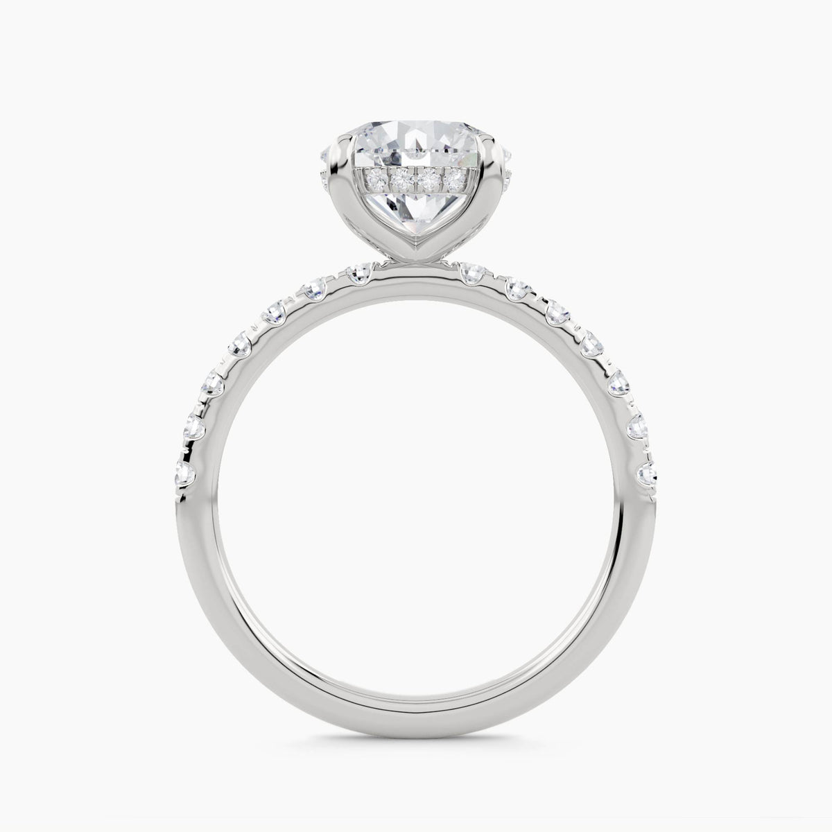 Solitaire engagement ring with hidden halo and pave set shank, front view
